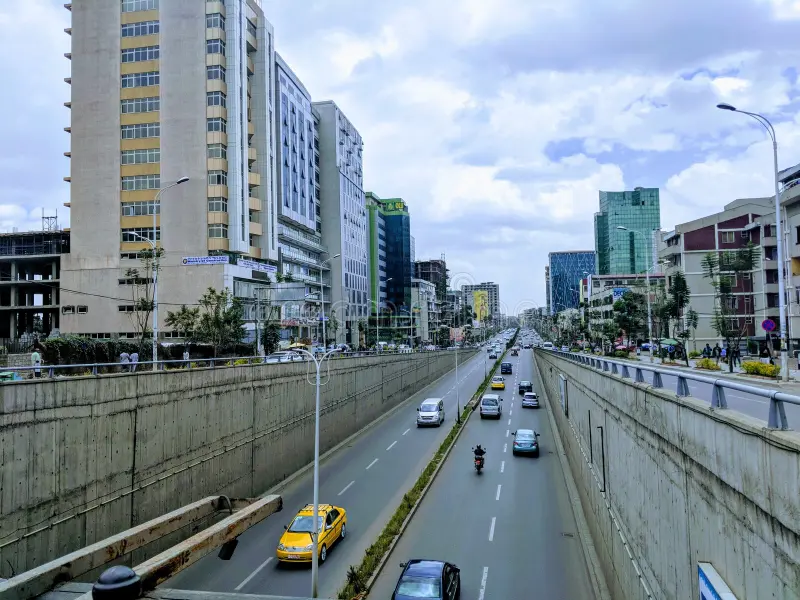 Cityscape with trees and buildings at sunset, perfect neighborhood to stay in Addis Ababa.