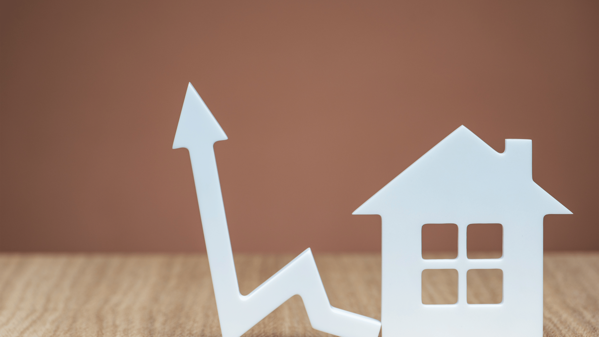 Home price growth concept with house and arrow showing increasing trend in Addis Ababa's housing market.