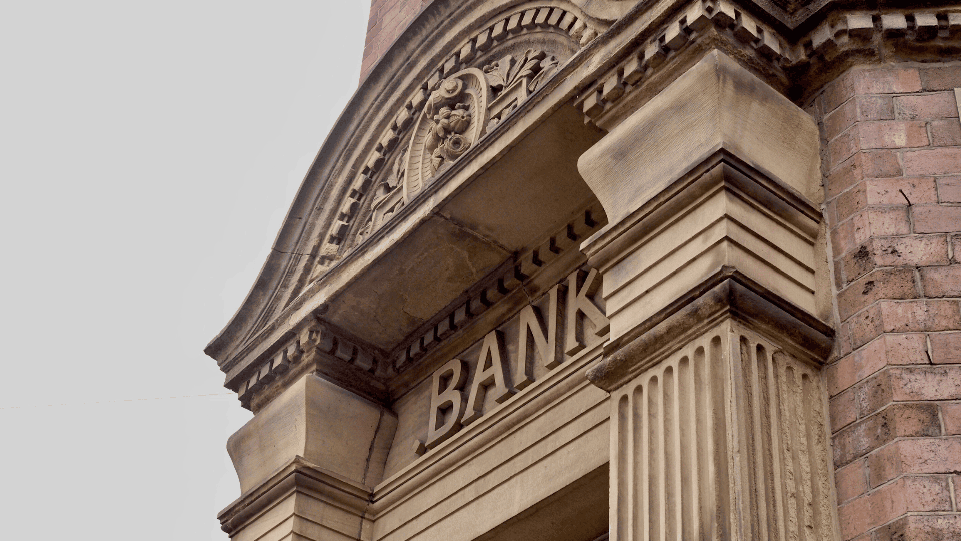 A bank building with a sign displaying the bank's name.