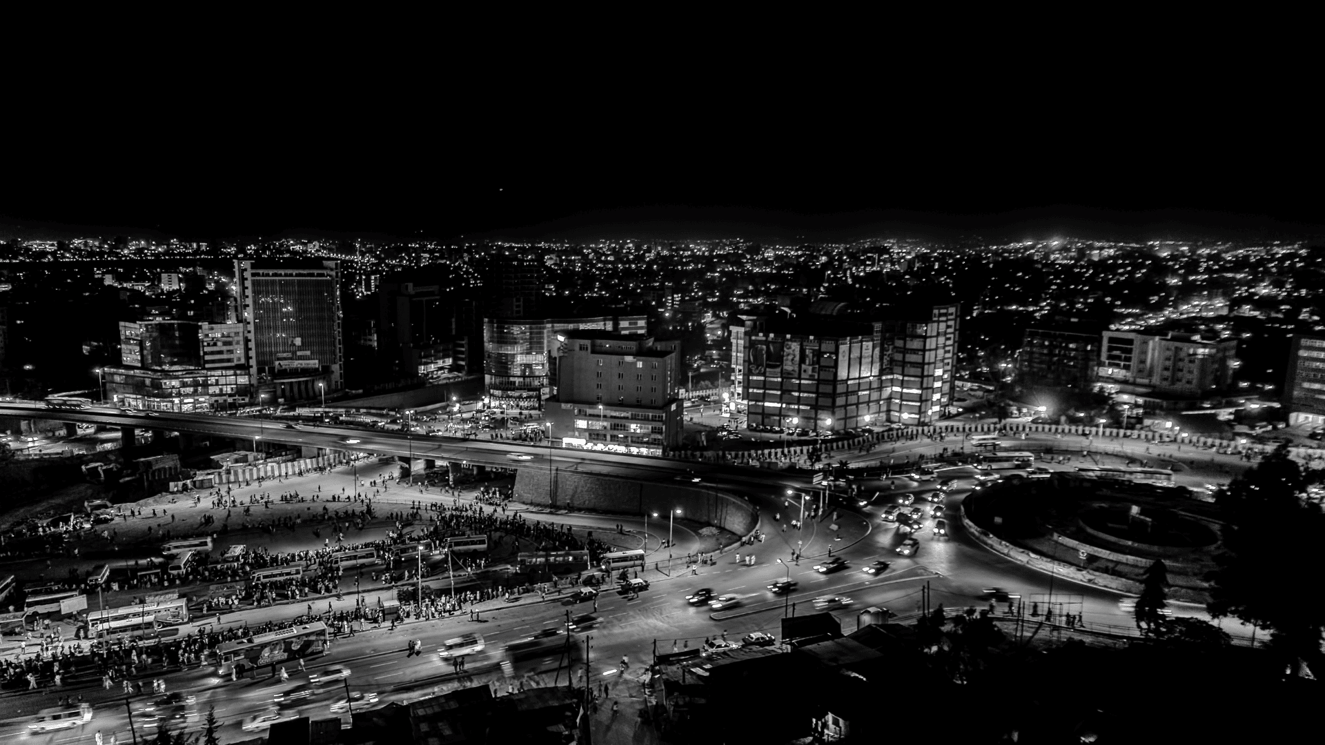 Black and white image of Addis Ababa's cityscape at night, highlighting The Richest Neighborhoods In Addis Ababa.