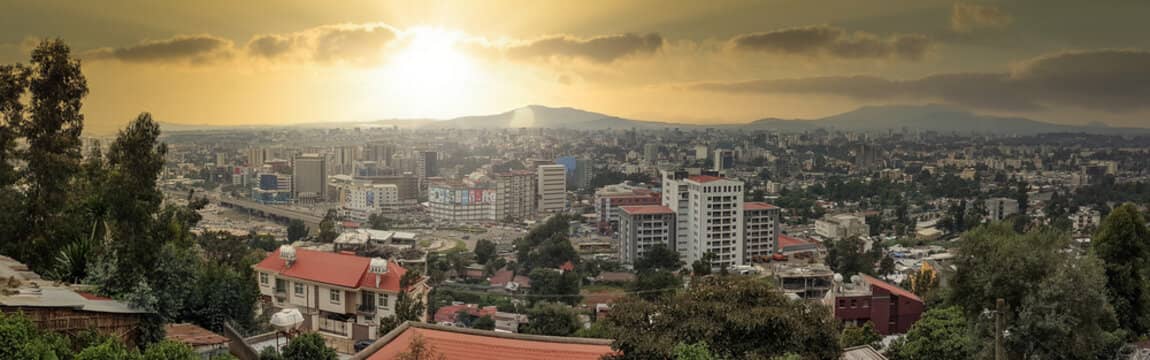 Sunset over Addis Ababa city skyline with trees and buildings, best neighborhood to stay in addis ababa.